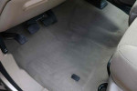 Interior view of 2005 Ford F-250 Super Duty XLT showing floor and pedals in beige upholstery