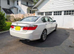 2013 Honda Accord Sport in white with 52,000 miles, parked in driveway with garage background.