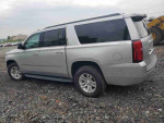 2019 Chevrolet Suburban LS in silver, showing side profile with 74,564 miles for sale at $11,800