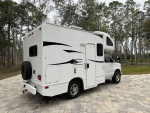 2012 Thor Motor Coach Majestic 19G RV parked in a scenic area with new tires and fresh paint.