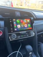 Interior view of a 2016 Honda Civic EX showing the infotainment system with Apple CarPlay features.