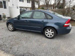 2007 Volvo S40 2.4i FWD parked, displaying minor exterior damage and a clean design