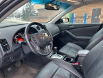 Interior view of 2012 Nissan Altima 2.5 SL with low mileage, featuring leather seats and modern dashboard.