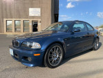 2004 BMW M3 in Mystic Blue with new OEM seats, showing exterior features and details at a parking lot.