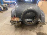 Rear view of a 1928 Dodge Brothers sedan with an Ohio license plate and spare tire, showcasing its vintage design.