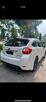 White 2015 Subaru Impreza hatchback with new tires and neat interior for sale in Quebec.