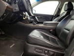 Interior view of a black 2012 Acura MDX highlighting leather heated seats and modern dashboard features.