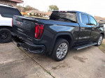 2022 GMC Sierra 1500 Denali 4WD parked, showcasing its sleek design and immaculate condition.