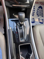2016 Honda Accord LX center console with gear shift and controls, well-maintained vehicle interior.