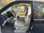 Interior view of 2009 Chevrolet Silverado 1500 Work Truck showing driver and passenger seats.
