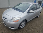 2009 Toyota Yaris in silver, great condition, low mileage, parked on a clean surface
