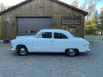 1949 Ford Custom 2-door sedan in excellent condition, showcasing unique flathead V8 and custom dual exhaust.