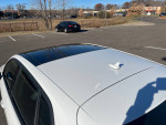 2016 Audi A3 E-Tron showing clean white exterior and sunroof on a clear day.