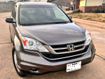 2011 Honda CRV in excellent condition with 147K miles, clean TX title, original owner, parked on a street