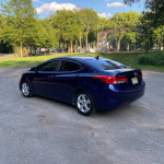 2011 Hyundai Elantra GLS in blue parked in a park with trees, well maintained with clean title and no accidents.