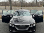 2015 Hyundai Genesis 3.8 Ultimate Trim with open doors showcasing its luxurious design and features.