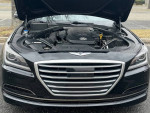 2015 Hyundai Genesis with hood open, showcasing a clean engine and luxury features, 65,000 miles, for sale.