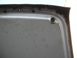 Close-up of the interior detail showing worn leather and rust on a vintage 1972 BMW car door.