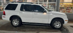 2005 Mercury Mountaineer for sale, white SUV with beige interior, good tires and features.
