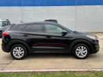 2019 Hyundai Tucson in excellent condition, black exterior, side view with clean lines and new tires