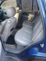 Interior view of a Chevy TrailBlazer showing rear seating area with gray upholstery.