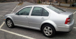 2004 Volkswagen Jetta TDI silver sedan with low mileage parked in an empty lot