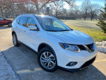 White 2015 Nissan Rogue SL parked in a scenic area, showcasing low mileage and various luxurious features.