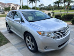 Silver 2010 Toyota Venza parked outside, showcasing its excellent condition and stylish design.