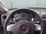 Interior view of a 2007 Pontiac Grand Prix showing the dashboard and gauges, in very good condition.