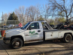 2003 Chevy 3500HD wrecker tow truck with Duramax engine and plow mount, ready for repair and towing.
