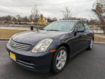 2004 Infiniti G35 sedan in clean condition parked by the road, showcasing its sleek design.