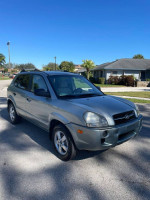 2008 Hyundai Tucson in excellent condition with new tires and clean title, parked in a sunny neighborhood.