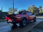 2003 Toyota Tacoma Pre-Runner with TRD Off-Road package parked, showcasing vibrant red color and good condition.