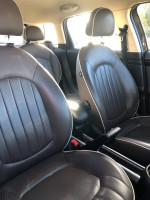 Interior view of 2012 MINI Cooper showing well-maintained leather seats and stylish design.