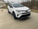 2016 Toyota RAV4 SE FWD in Super White with clean exterior parked in a driveway.