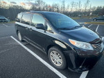 2014 Toyota Sienna XLE in a parking lot with minor body damage and new tires and brakes