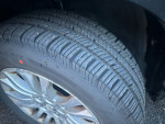 Close-up of the tire tread on a 2014 Sienna XLE, showcasing new front and rear tires.