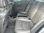 Interior of a 2006 CLS55 showing spacious grey leather back seats and modern design elements.