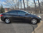 Side view of a clean 2011 Hyundai Sonata GLS FWD in excellent condition with low mileage.