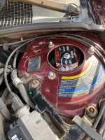 Close-up of the engine compartment in a 2002 Buick Century, showcasing maintenance details and components.