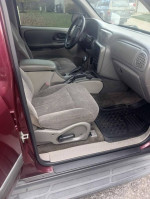 Interior view of a 2004 Chevrolet TrailBlazer showcasing clean seats and dashboard.
