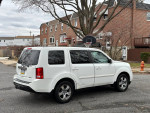 2014 Honda Pilot EX-L FWD parked on the street with alloy wheels and a clean exterior.