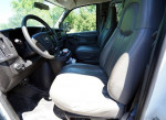 Interior view of a 2008 Chevrolet Express van showing leather seats and dashboard.