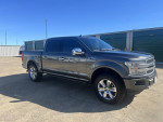 2018 Ford F-150 Platinum 4WD truck in excellent condition with new tires and brakes, parked outdoors.