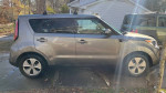2014 Kia Soul in good running condition with minor scratches for sale, featuring side view.