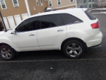 2008 Acura MDX SUV in white, showcasing side view with tinted windows and alloy wheels, ideal for families.
