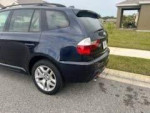 2007 BMW X3 with 126k miles parked, showcasing its luxury and sportiness