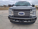 Front view of a 2017 Ford F250 Platinum truck with 98k miles, showcasing its clean design and features.