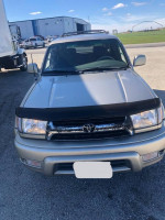 Front view of a 2002 Toyota 4Runner SUV in good condition with 63,000 miles, tan color, and 4WD capability.