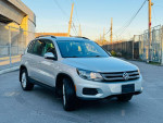 2015 Volkswagen Tiguan SE 4Motion AWD in silver, featuring clean design and modern exterior details.